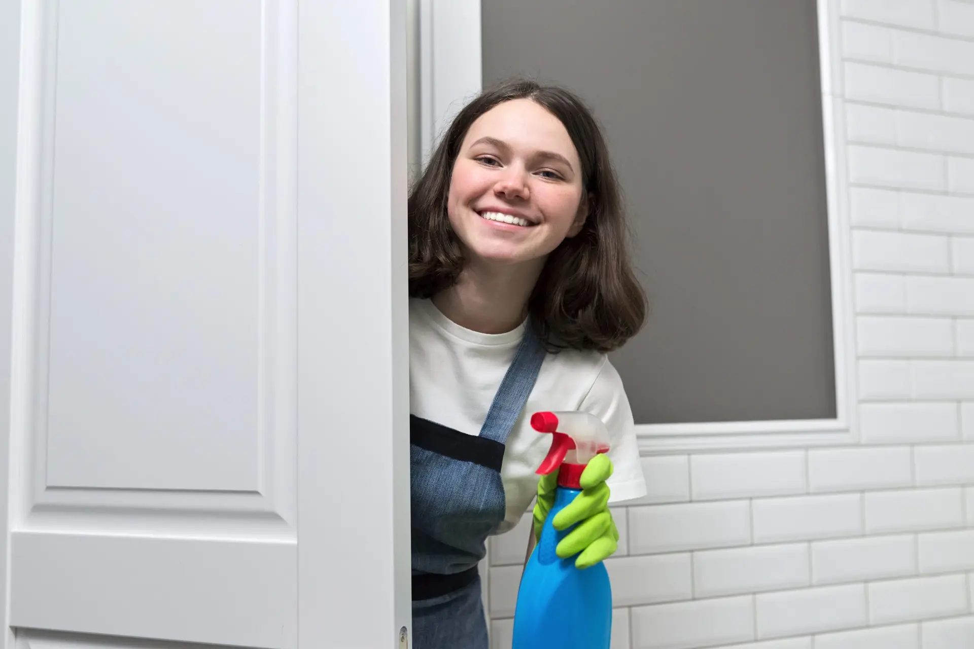 alliance cleaning services team member smiling after cleaning bathroom scaled alliance cleaning services team member smiling after cleaning bathroom scaled