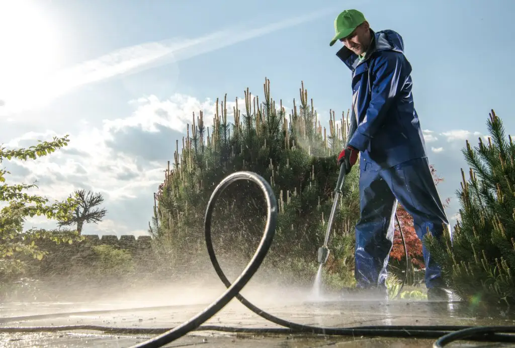 man carrying out exterior pavers washing in one of Melbourne house
